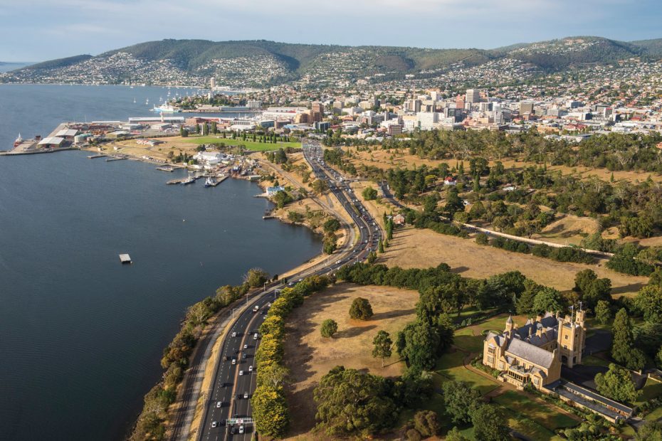 Aerial view of Hobart by the water with mountain in the background