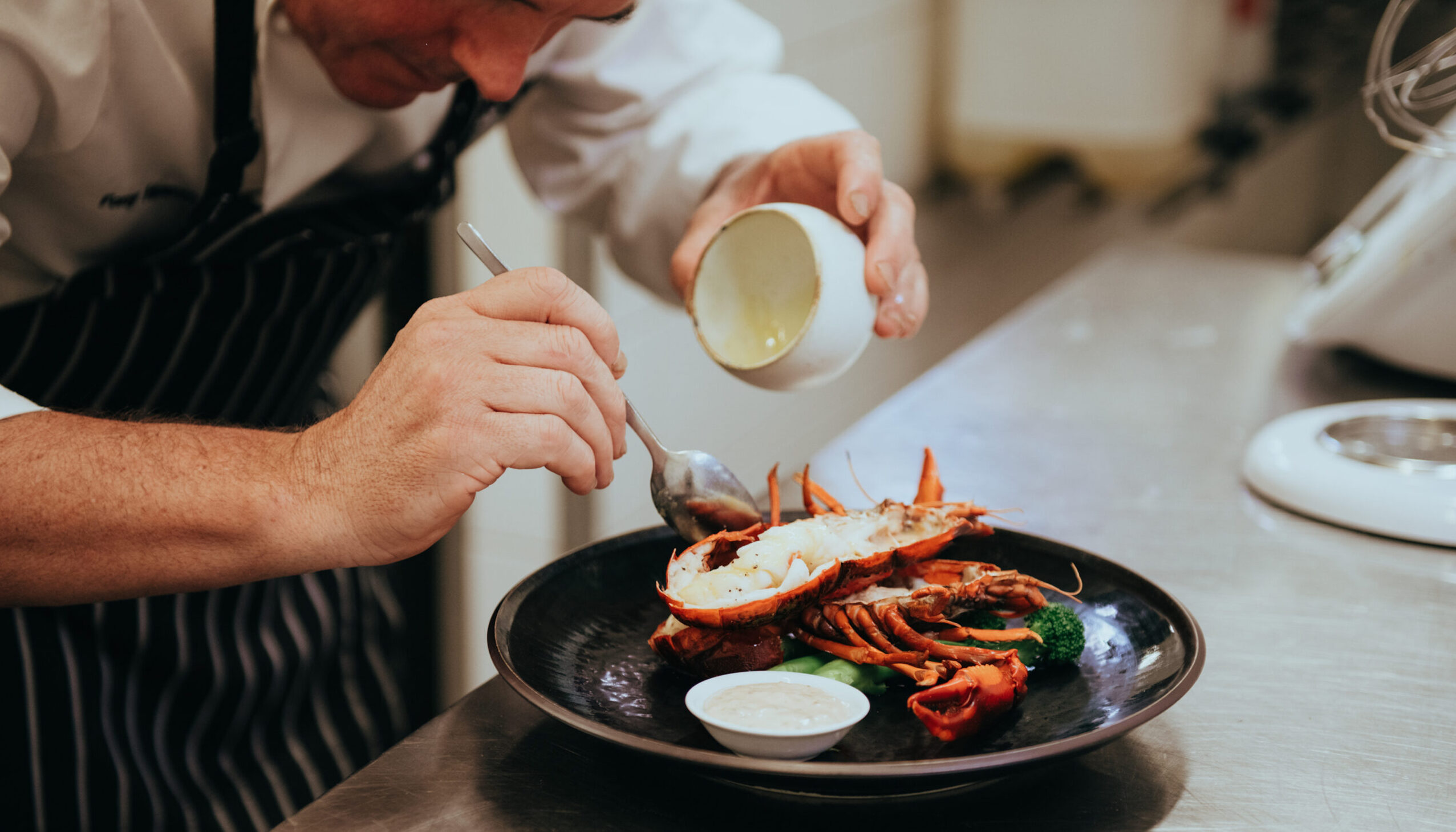 Cape Lodge chef Tony Howell preparing dish with West Australian Marron