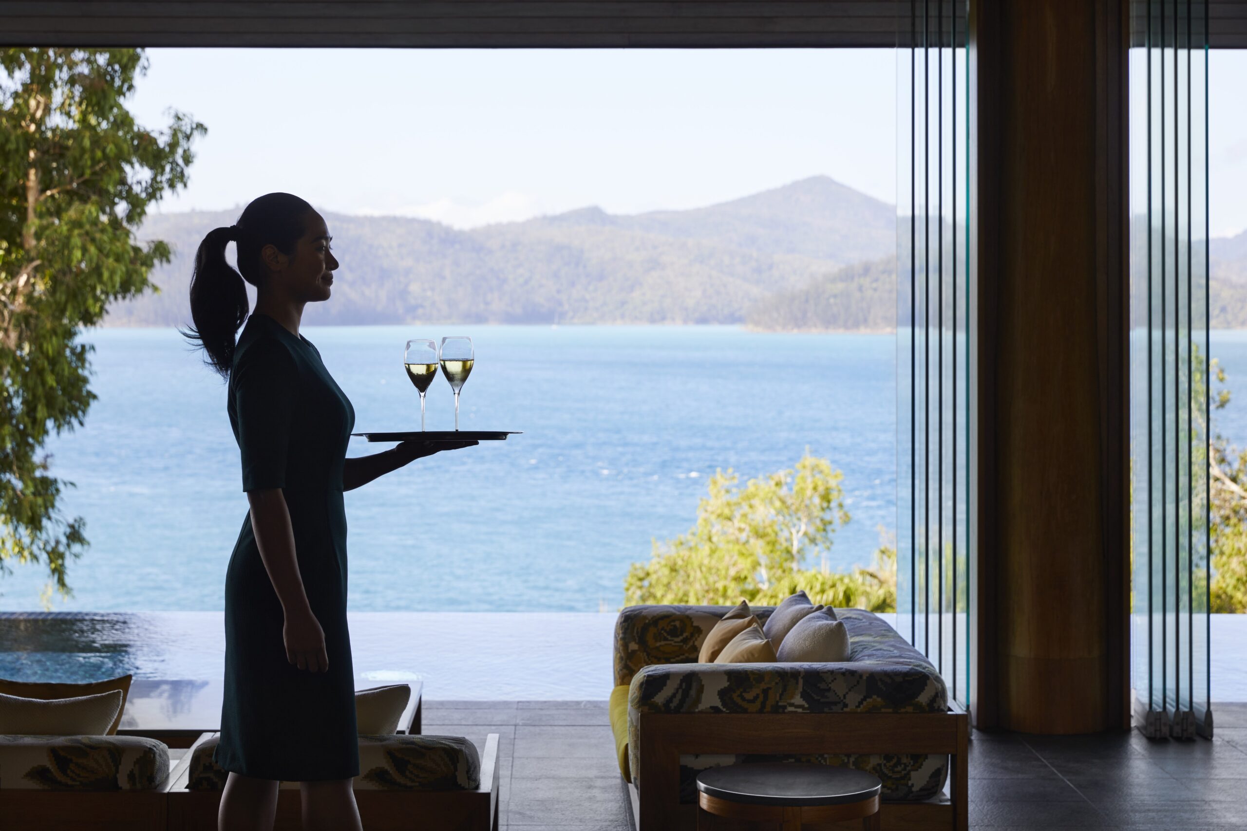 Welcome drink at qualia luxury resort Hamilton Island Whitsunday view behind