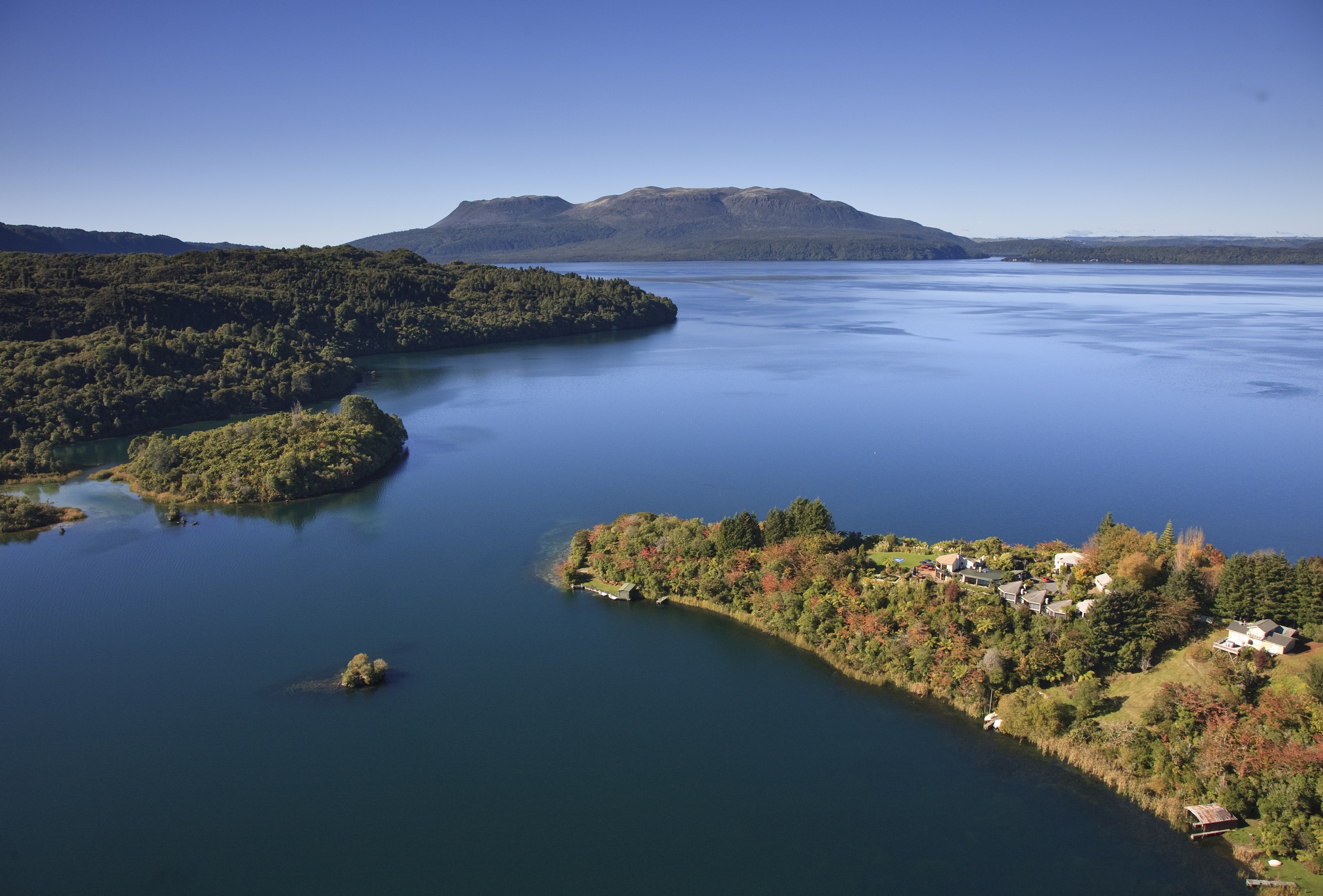 View of Solitaire Lodge overlooking Lake Tarawera and Mount Tarawera in the distance