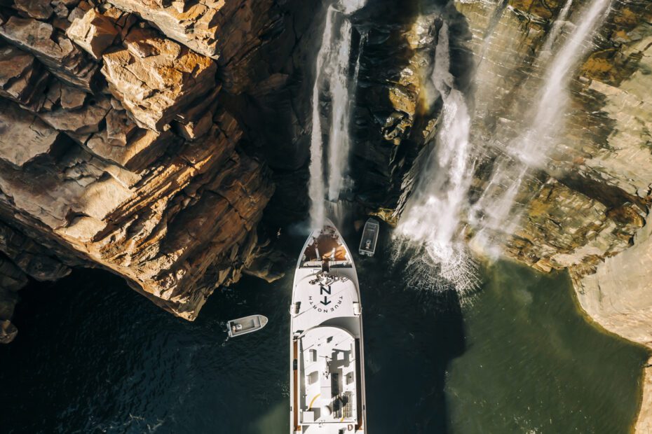 True North cruise ship under waterfalls