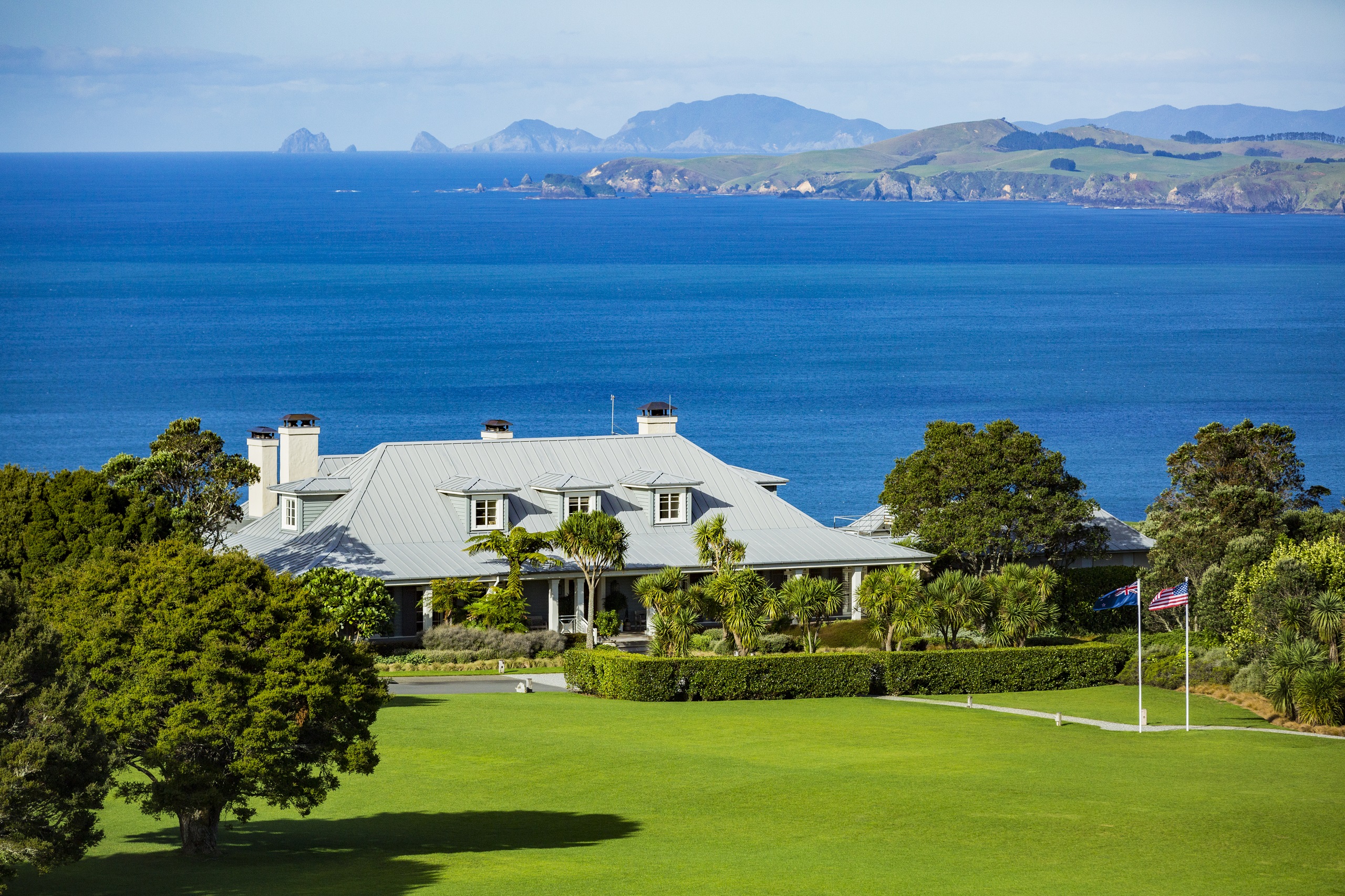 Exterior view over the lodge to the ocean at The Lodge at Kauri Cliffs
