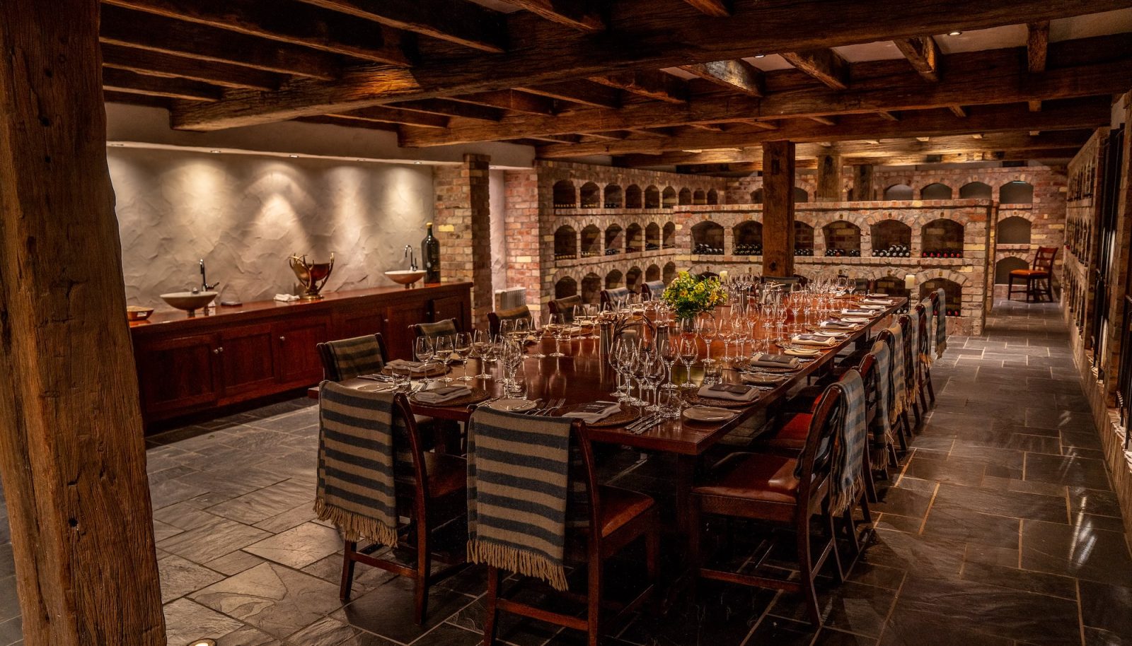 Luxury fishing lodge New Zealand Poronui underground wine cellar dining