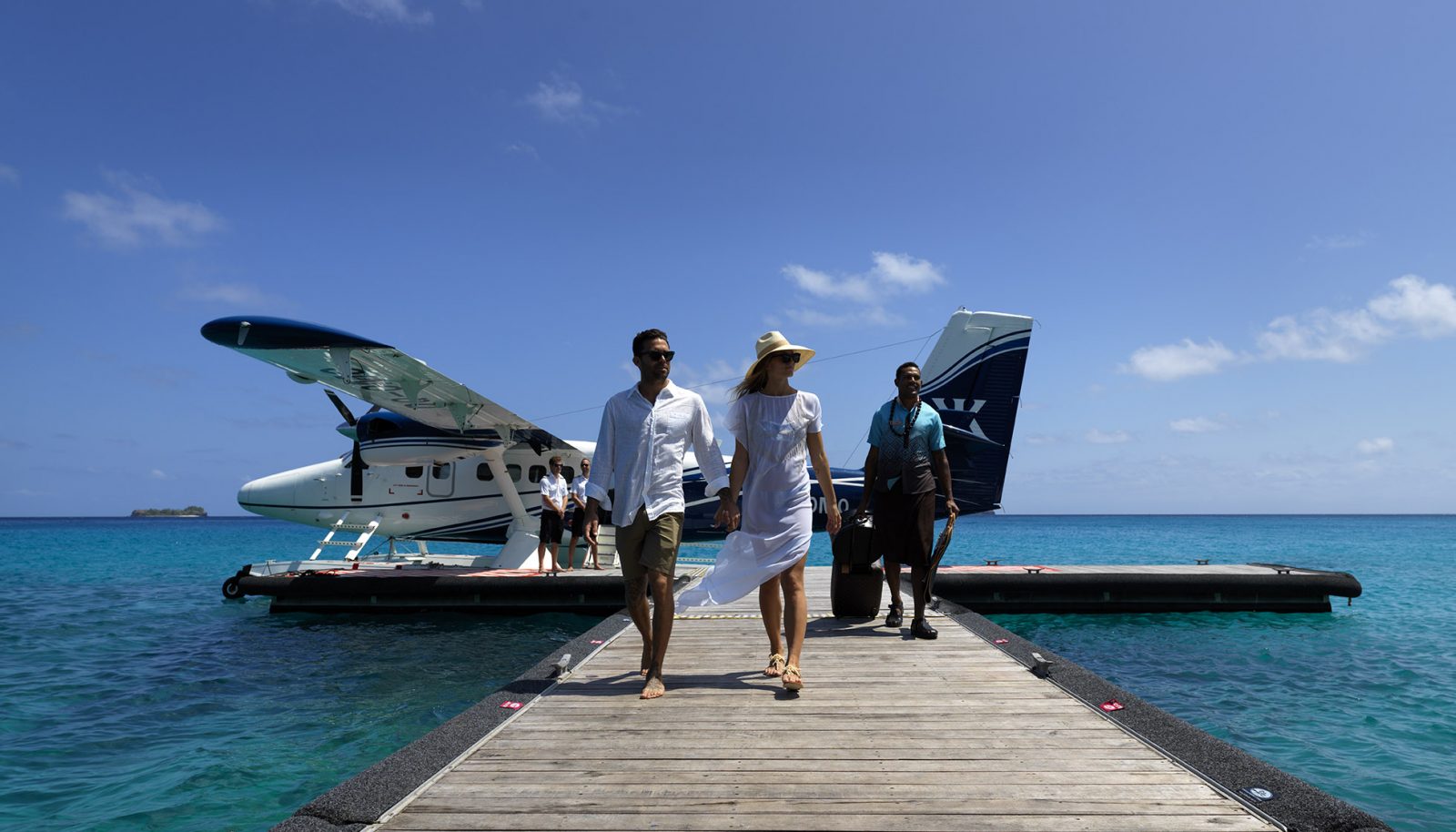 Couple arriving off a seaplane on Kokomo Private Island