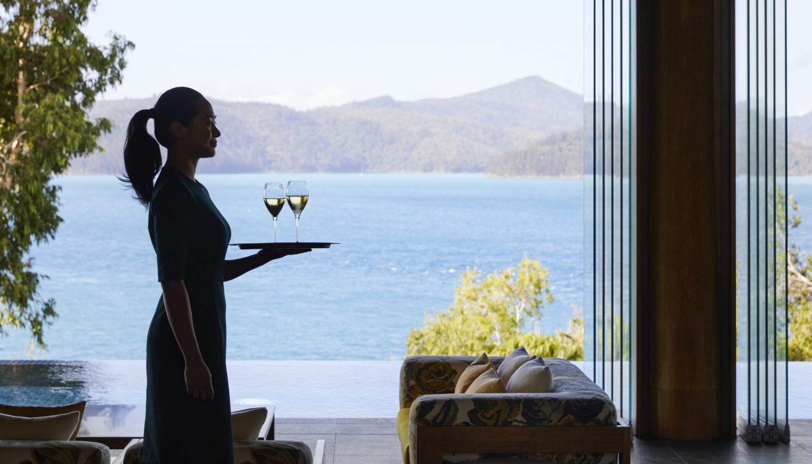 Welcome drink at qualia luxury resort Hamilton Island Whitsunday view behind